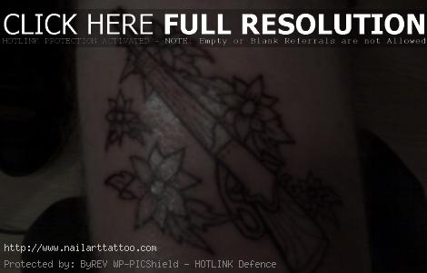 Gun And Flower Tattoos