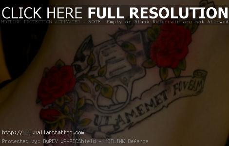 Skull Rose And Gun Tattoos