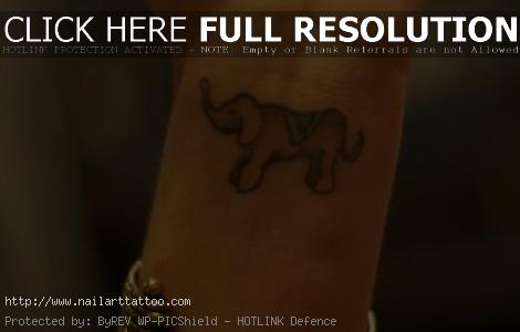baby elephant tattoos behind ear