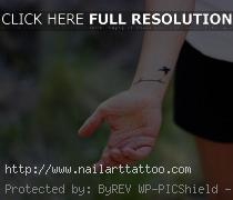 bird cage tattoo wrist