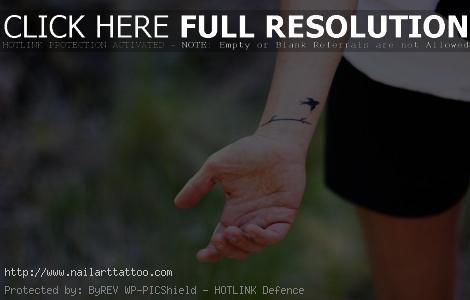 bird cage tattoo wrist