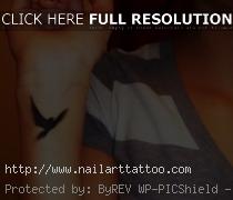 bird cage tattoos on wrist