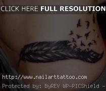 bird feather tattoo on hip