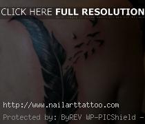 bird feather tattoo on shoulder
