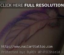 bird feather tattoo on wrist