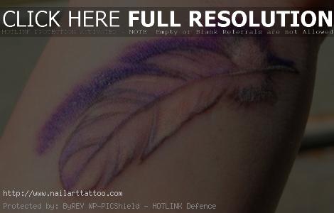 bird feather tattoo on wrist