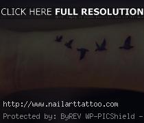 bird flying tattoo meaning