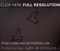 bird outline tattoo wrist