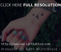 bird wrist tattoos for girls