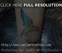 bird wrist tattoos with quotes