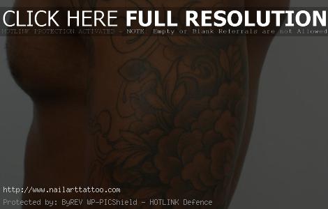 black and gray tattoos on dark skin