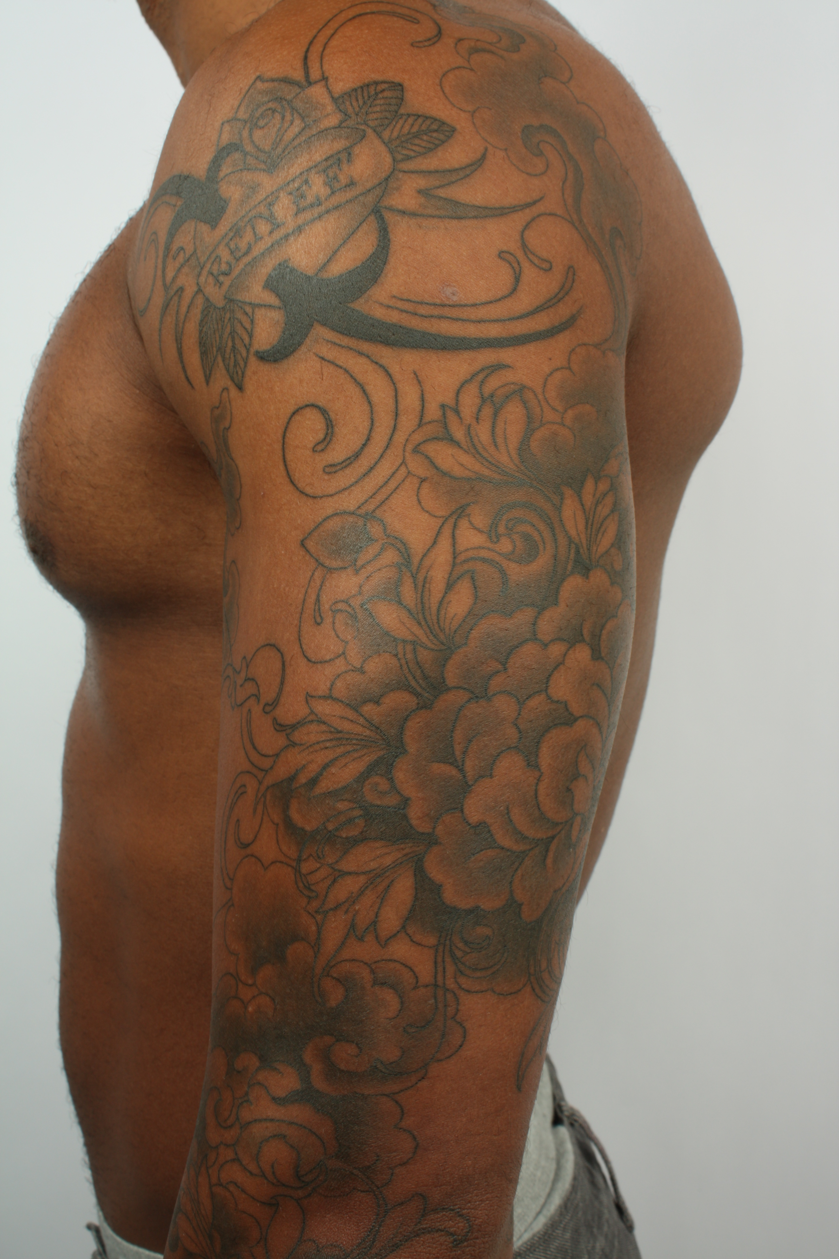 black and gray tattoos on dark skin