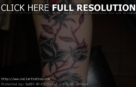 black and grey rose tattoo forearm