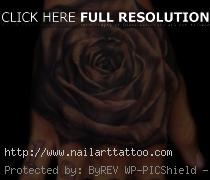 black and grey rose tattoo on hand