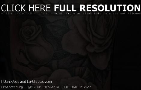 black and white flower tattoos on arm