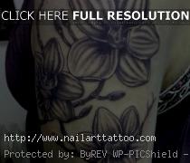 black and white flower tattoos on arm