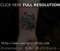 black and white rose tattoo on wrist