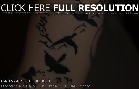 black bird tattoos on back