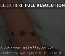 black bird tattoos on wrist
