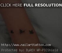 black bird tattoos on wrist