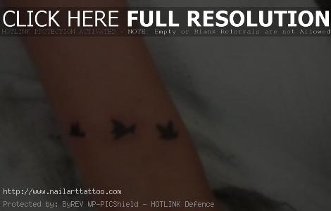 black bird tattoos on wrist