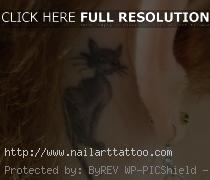 black cat tattoo behind ear