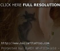 black cat tattoo behind ear