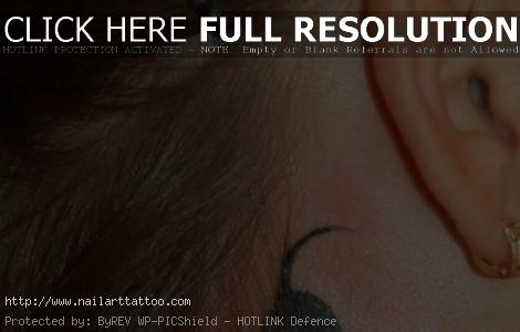 black cat tattoo ear