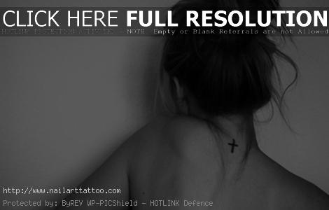 black cross tattoo on back of neck