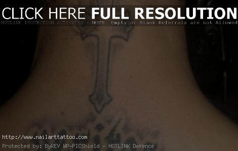 black cross tattoo on neck