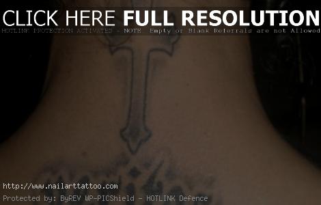 black cross tattoo on neck