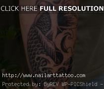 black koi tattoo forearm