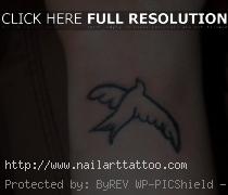 dove bird tattoos on wrist