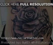 roses with barb wire tattoos