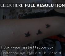 small bird tattoos on wrist