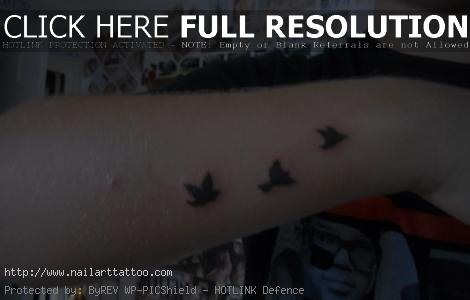 small bird tattoos on wrist