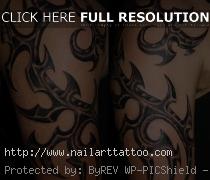 tribal biomechanical tattoo designs