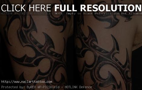 tribal biomechanical tattoo designs