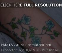 blue flower tattoo on foot