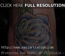 blue rose tattoo on ankle