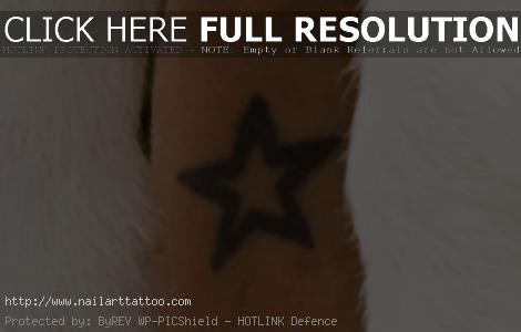 blue star tattoo on wrist