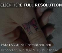 bow tattoo designs on finger