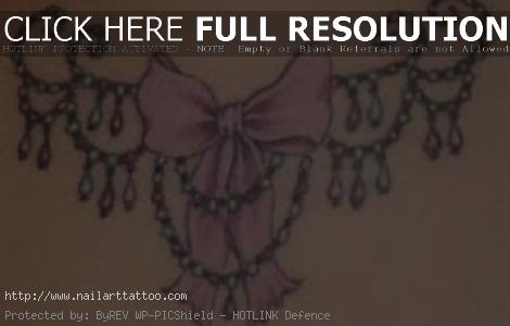 bow tattoos for girls on back