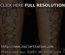 bow tie tattoos on back of legs