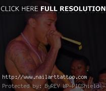 bow wow tattoos on arm