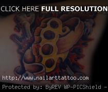 brass knuckles tattoo on hand