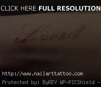 brown ink tattoo on dark skin