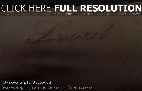 brown ink tattoo on dark skin