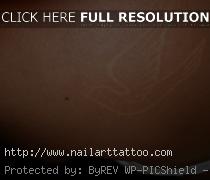 brown ink tattoos on black skin