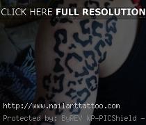 cheetah print tattoos on arm